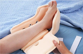 patient receiving pressure offloading boot fitting at podiatric clinic near you